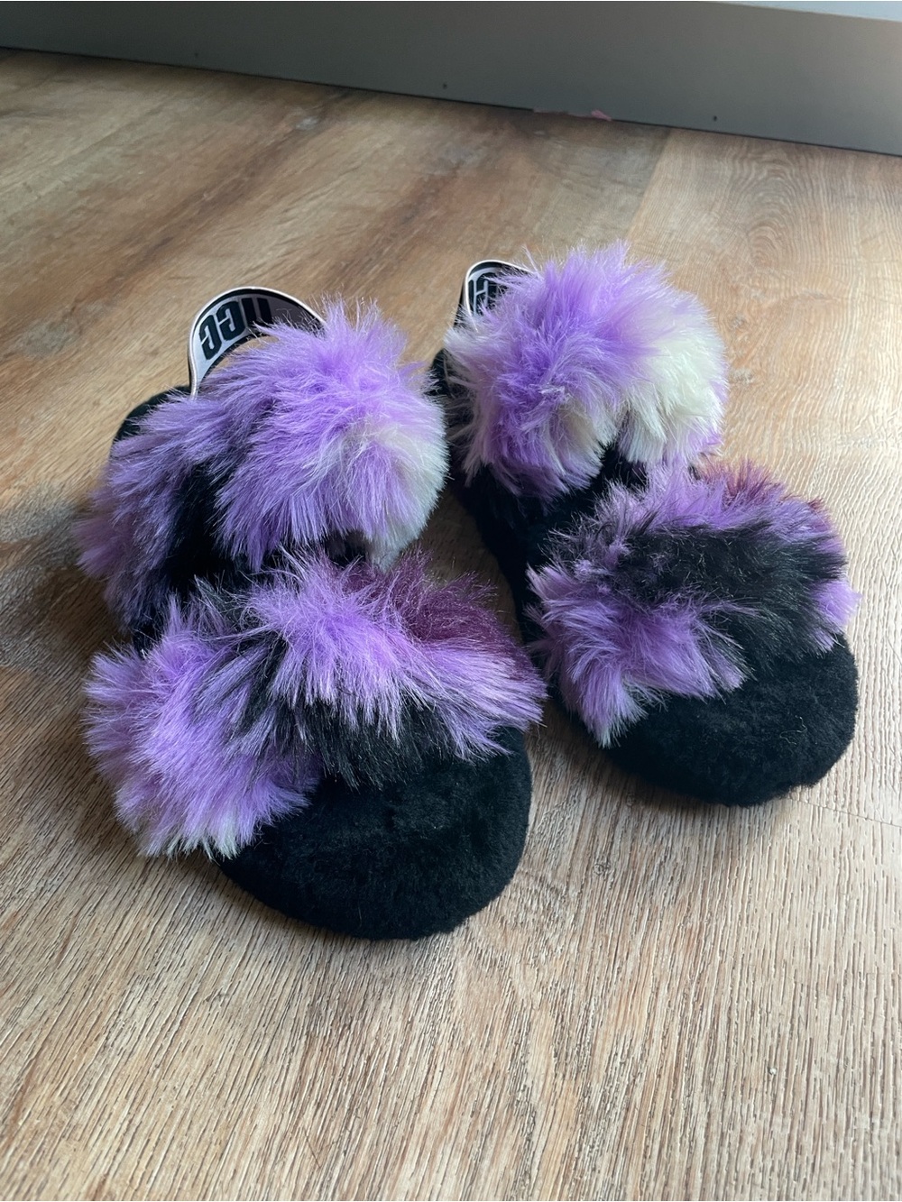 UGG Women’s Black Slides with Purple Faux-Fur Pom Poms